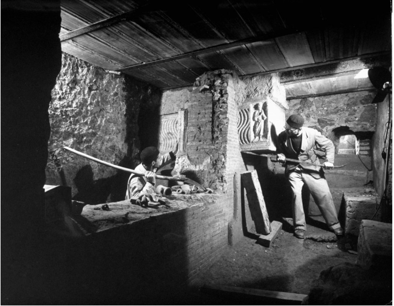 Posed for LIFE magazine in 1950s, maintenance team hacking away under St Peter's