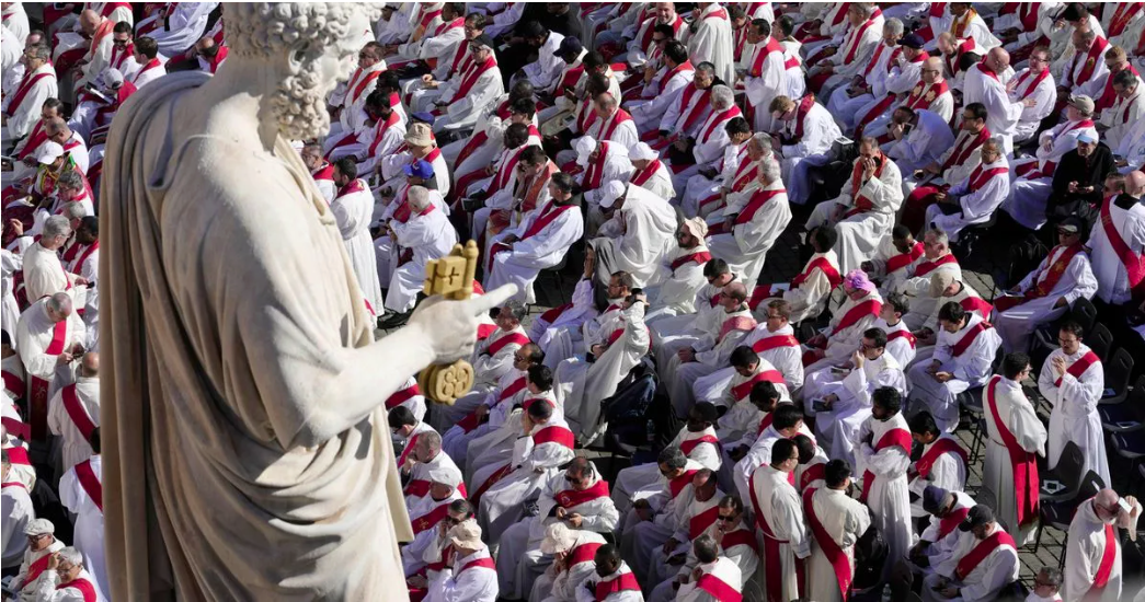 Statue of St Peter with keys to heaven and some of the 4000 priests at Francis's funeral