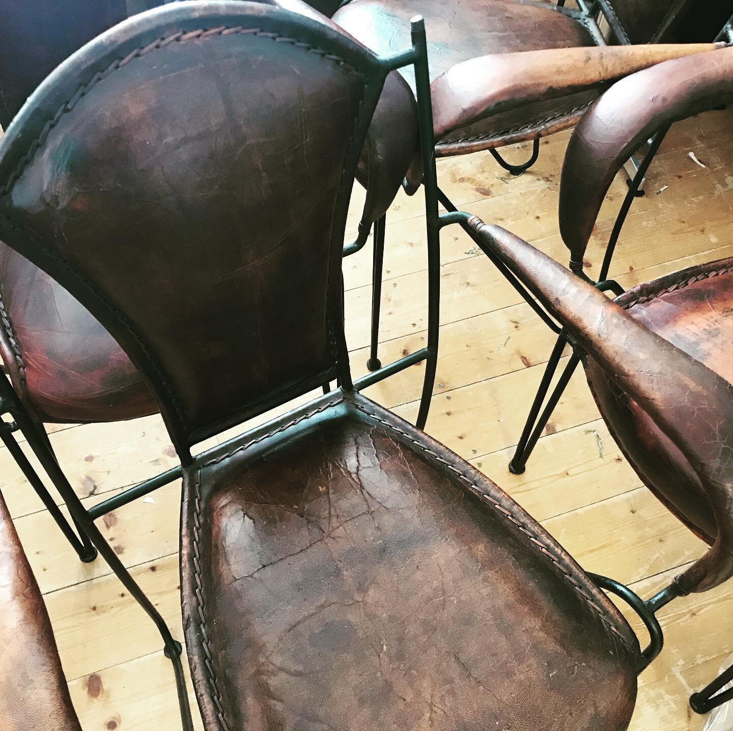 A set of four French 1950&rsquo;s Patio Armchairs by Jaques Adnet .
Seats and arm canvases have been replaced, a few repairs to the leather and missing laces replaced