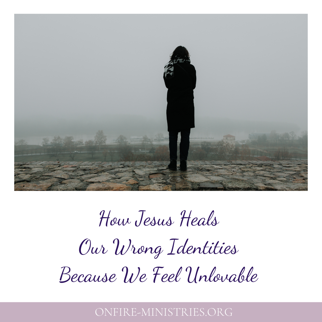 woman alone looking across a foggy lake