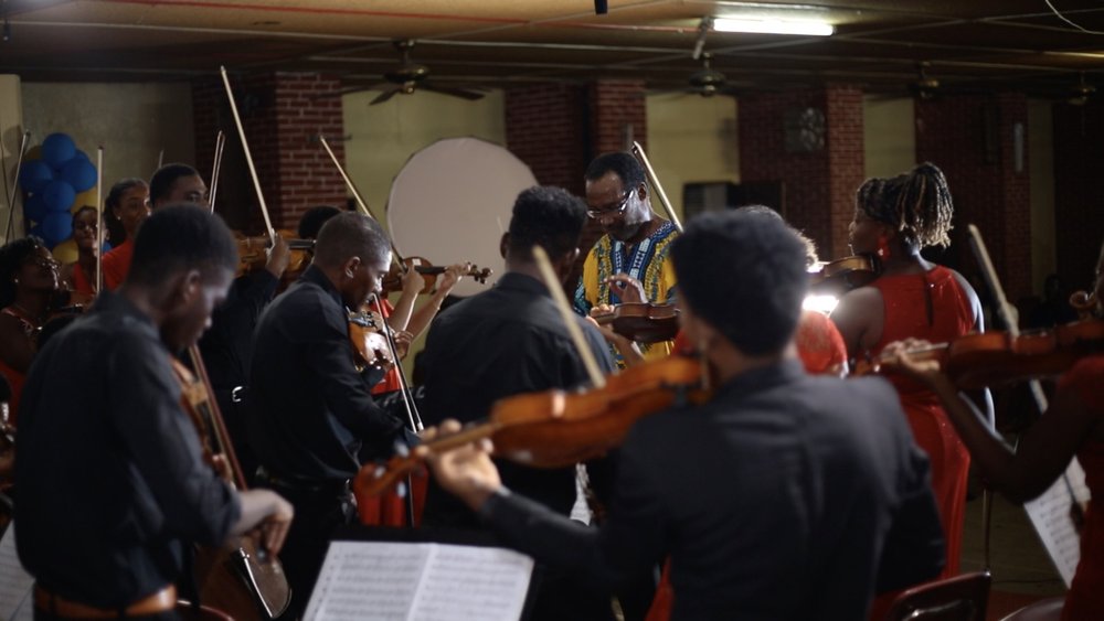 Rudy conducting in final concert.jpeg