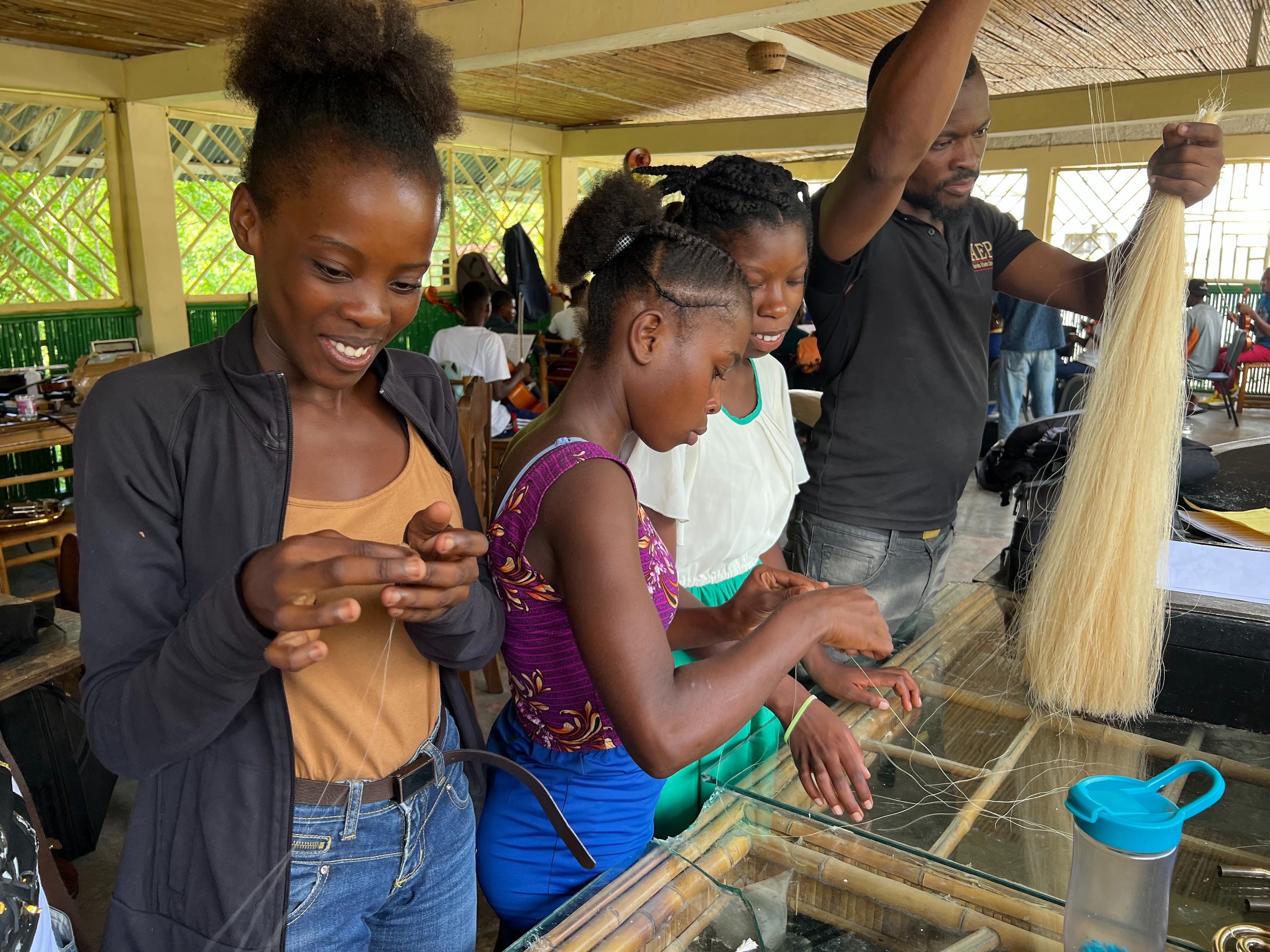 EMM Helping with bow rehairing.jpg