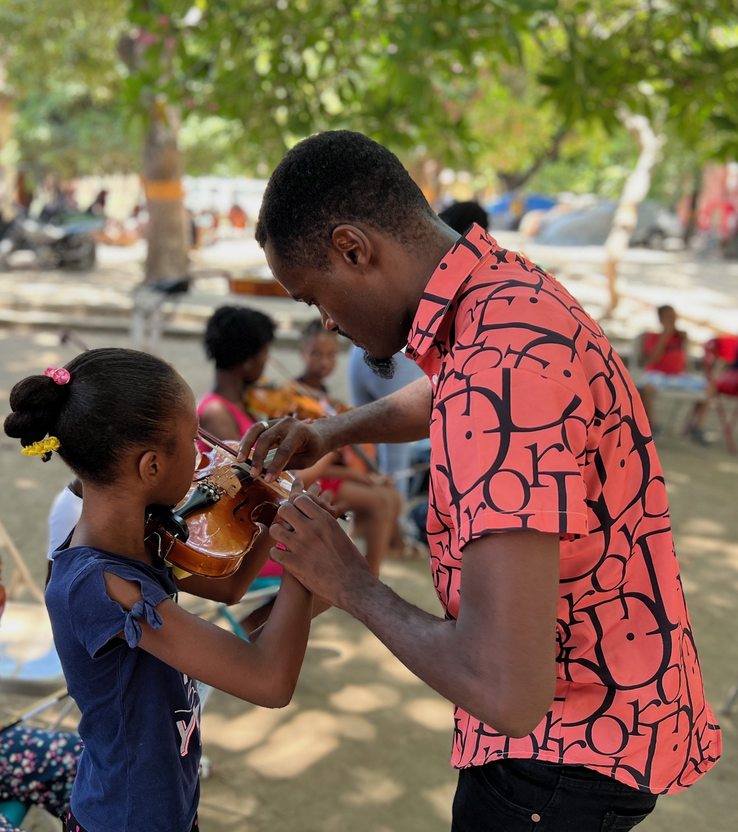 Camp Occide Jeanty Tchoupy and young violinist+.jpg