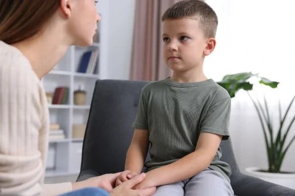 Parent helping ADHD child stay focused