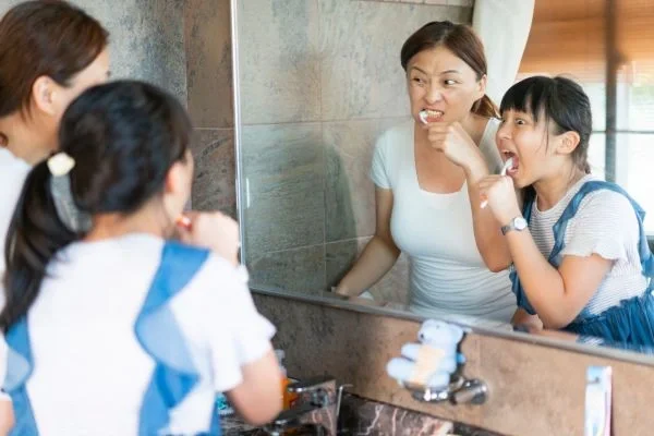 Parent helping child build daily routine