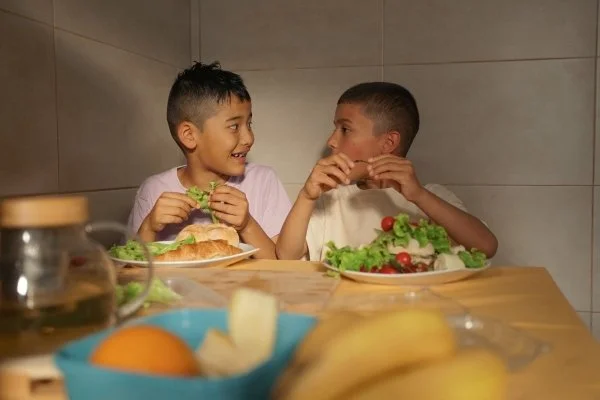 Brothers eating a healthy meal.