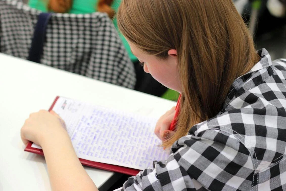 executive function student writing on a paper