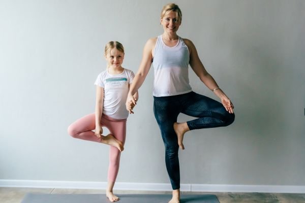 Parent and child engaged in balance training