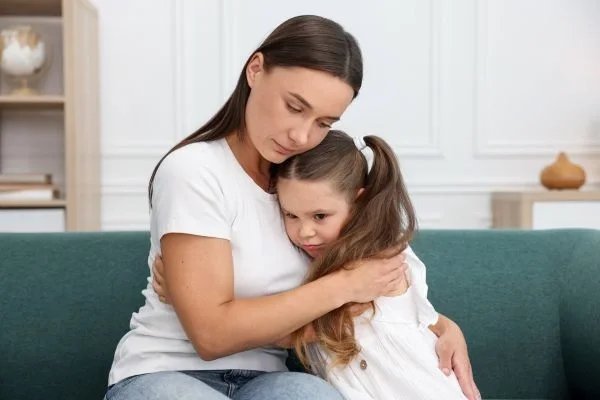 Parent helping child cope with feelings