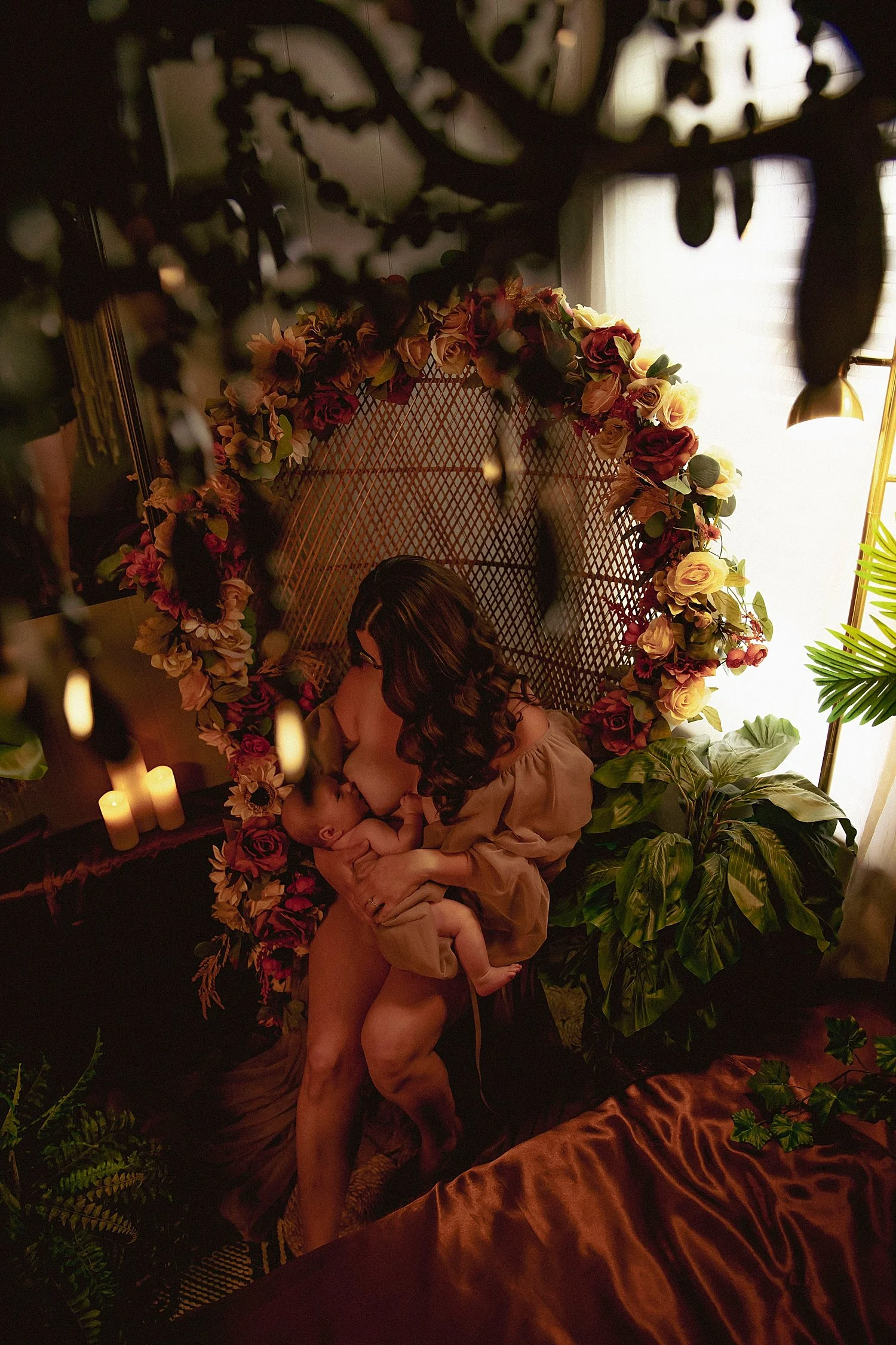mother sits in front of garden flowers by Chelsea Brinton Photography