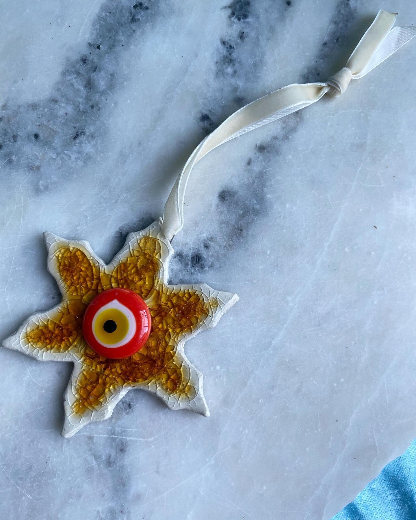 back on my mati evil eye grind🧿 but make it crispy cool for the holidooze☀️avail soon to keep madness out of your space 🌀be honest would you put these on the wall or on the tree? PS check the poll for info ok luv u bye more evil eyes coming soooooo