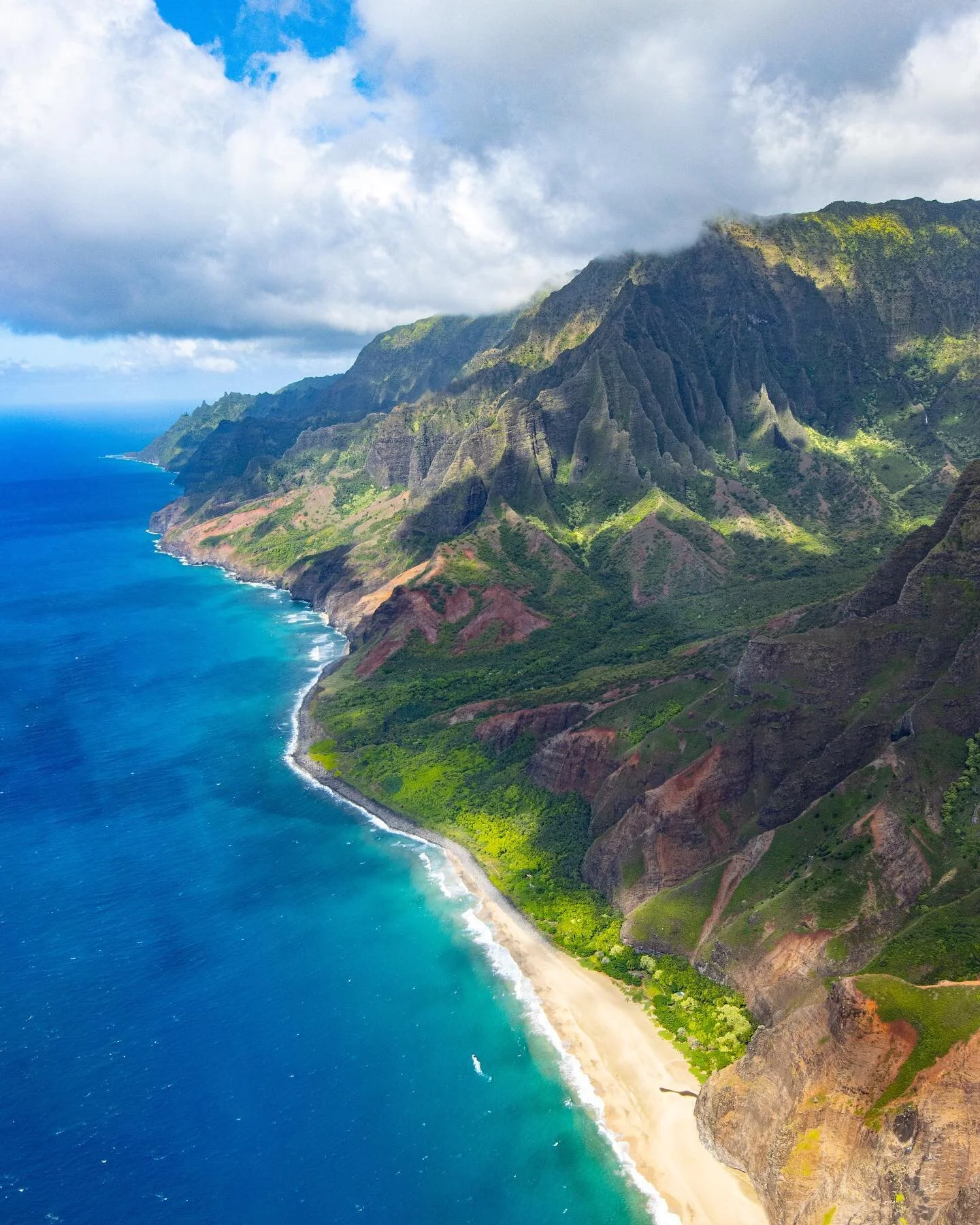 See the white dot in the water? That&rsquo;s actually a 20-30 ft boat! 

I was recently able to visit Nāpali Coast on a trip to Kauai. Incredibly beautiful, this spectacular coastline is sacred to the Hawaiian people. Created by volcanic eruptions an