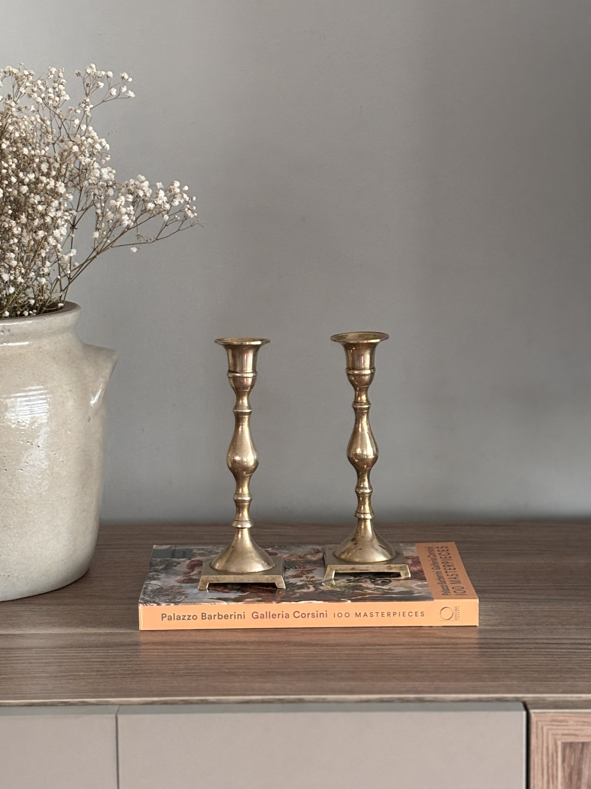 Shapely Pair Of Antique Brass Candlestick Holders