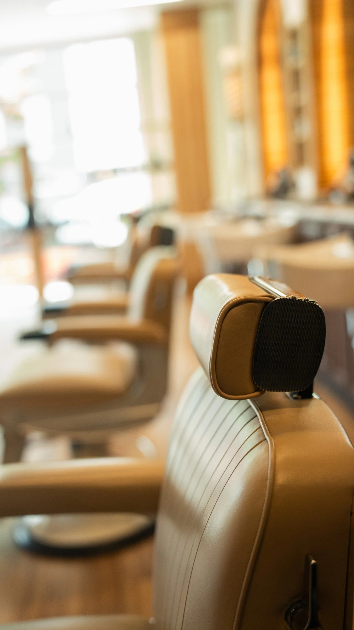 Master barber delivering a precision haircut and individual consultation at The Rosemont Barbers RiNo location.