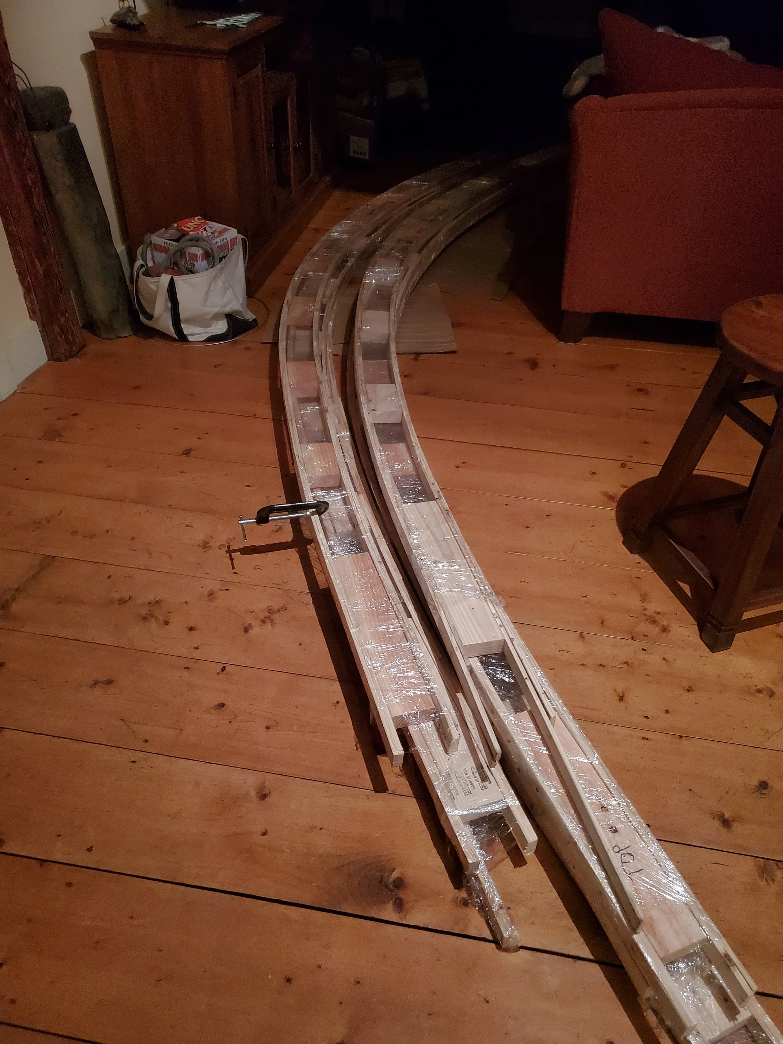 Curing the glue in the main house (note plastic wrap covering the rib to minimize glue mess)