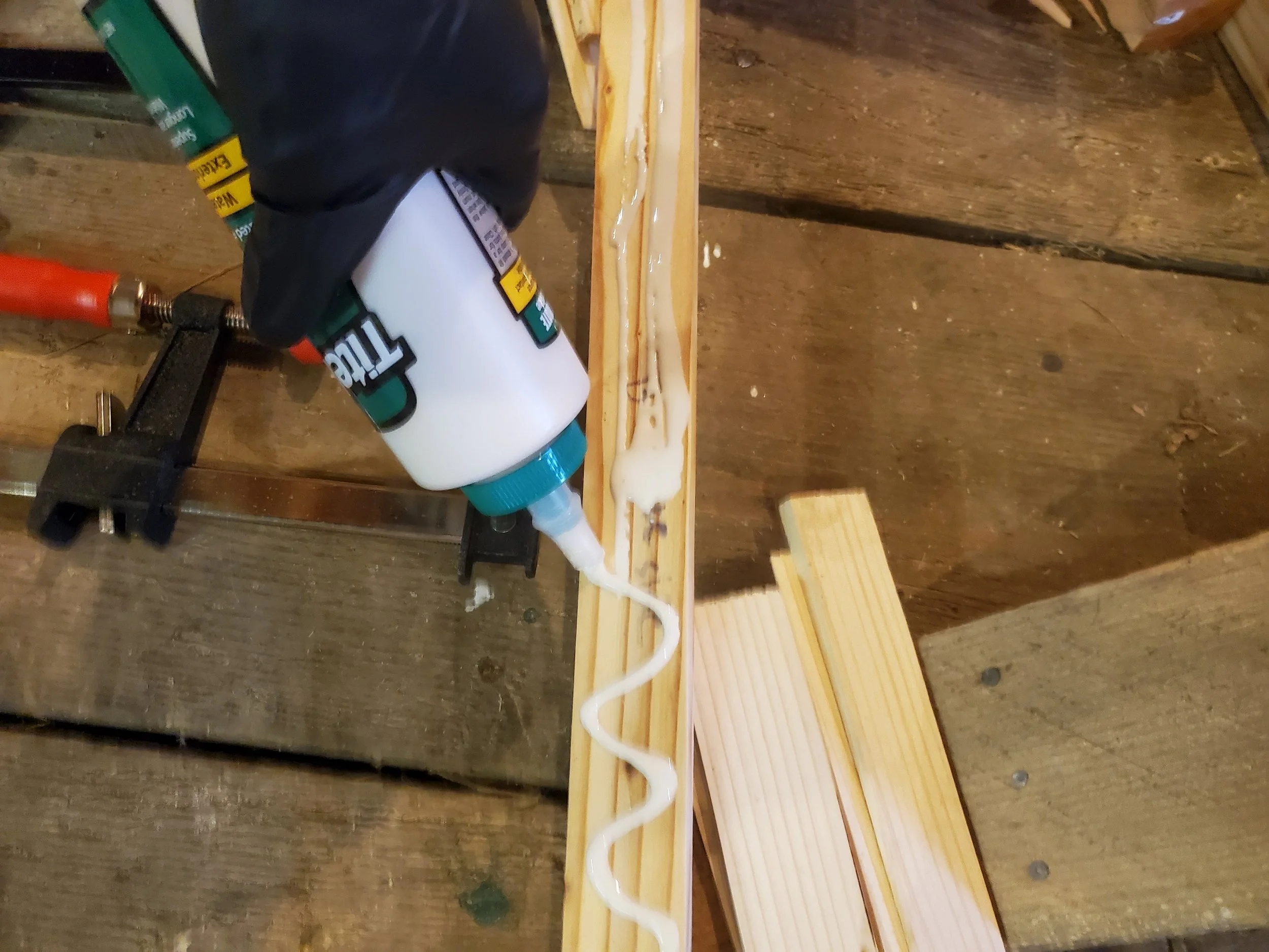 Applying a healthy amount of glue to the lamination side