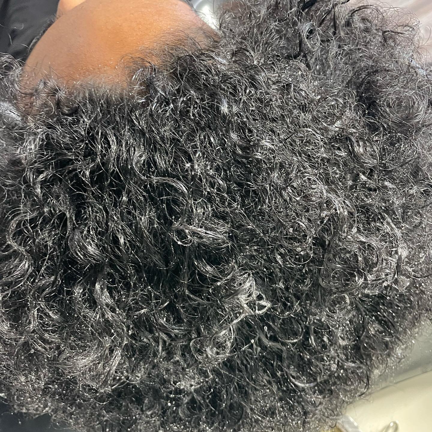 Zoom in! Tell me what you see.

The water is just sitting on top of the hair. This client uses natural handmade products that contain different oils and butters. After showing her the effects of using those products she is now rethinking her product 