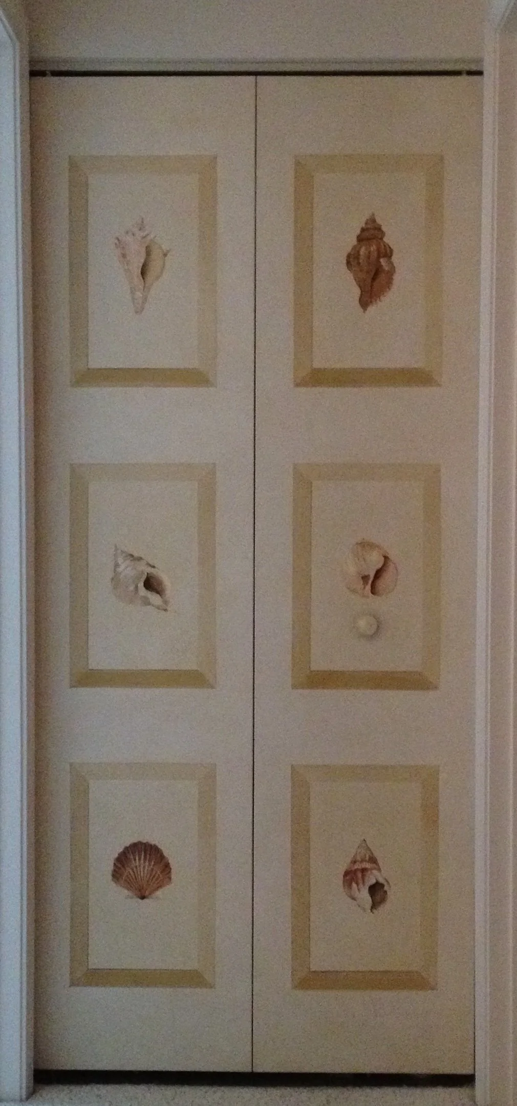 These shells were painted on glazed closet door panels in a beach home in Cape Cod...Brewster, MA
