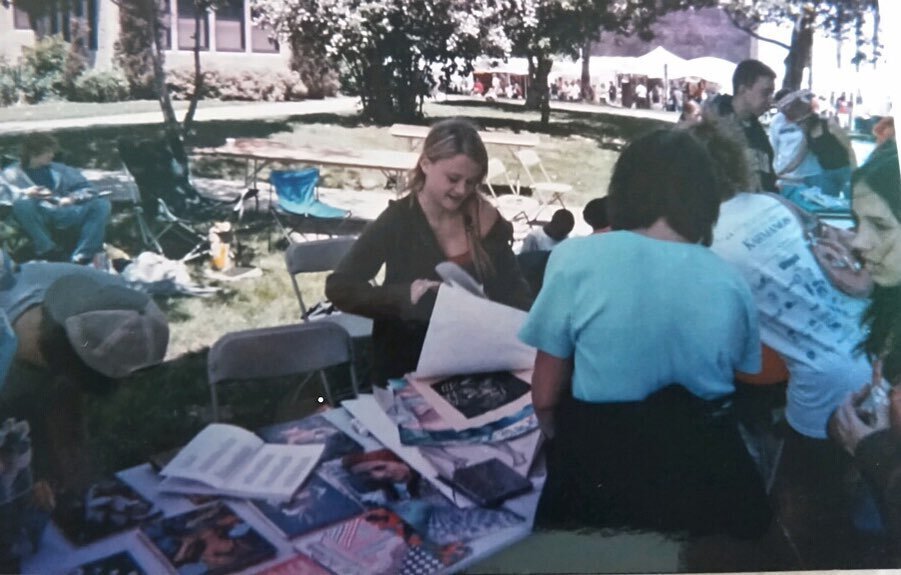 Very old pic from my first time ever vending art at the Detroit festival of the arts (RIP 🪦) in 2006! I&rsquo;m in high school, and I made my boyfriend at the time (to the left) help me set up and sell all my arts (not much has changed). I remember 