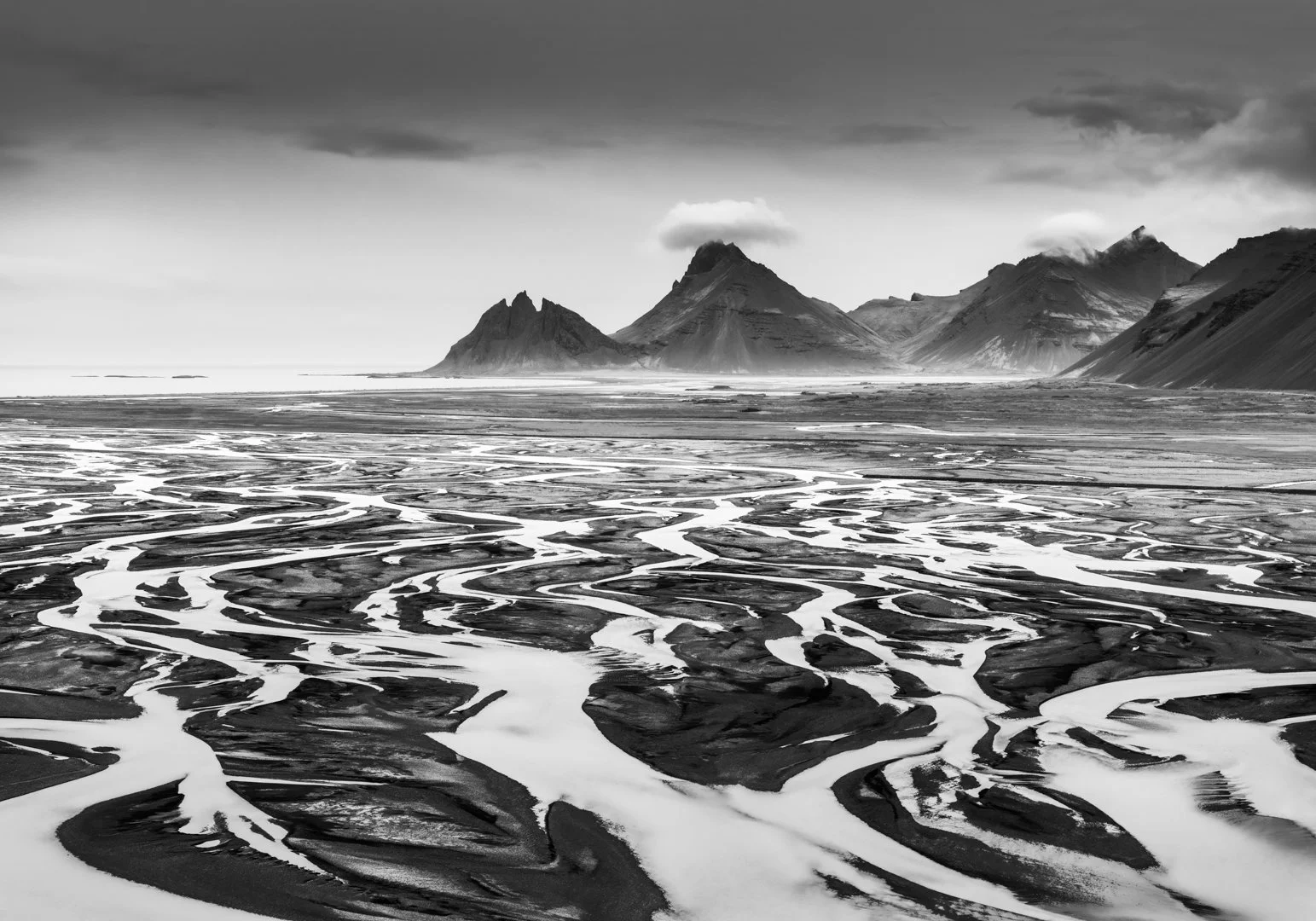 Vestrahorn from behind with river veins from drone. Zoom. Black and white.-.jpg
