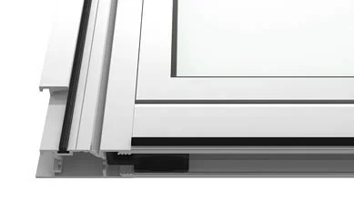 Close-up view of a sliding glass door frame corner, showing the metal track and frame details.