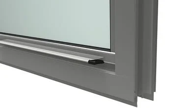 Close-up of a window frame with a sliding mechanism.