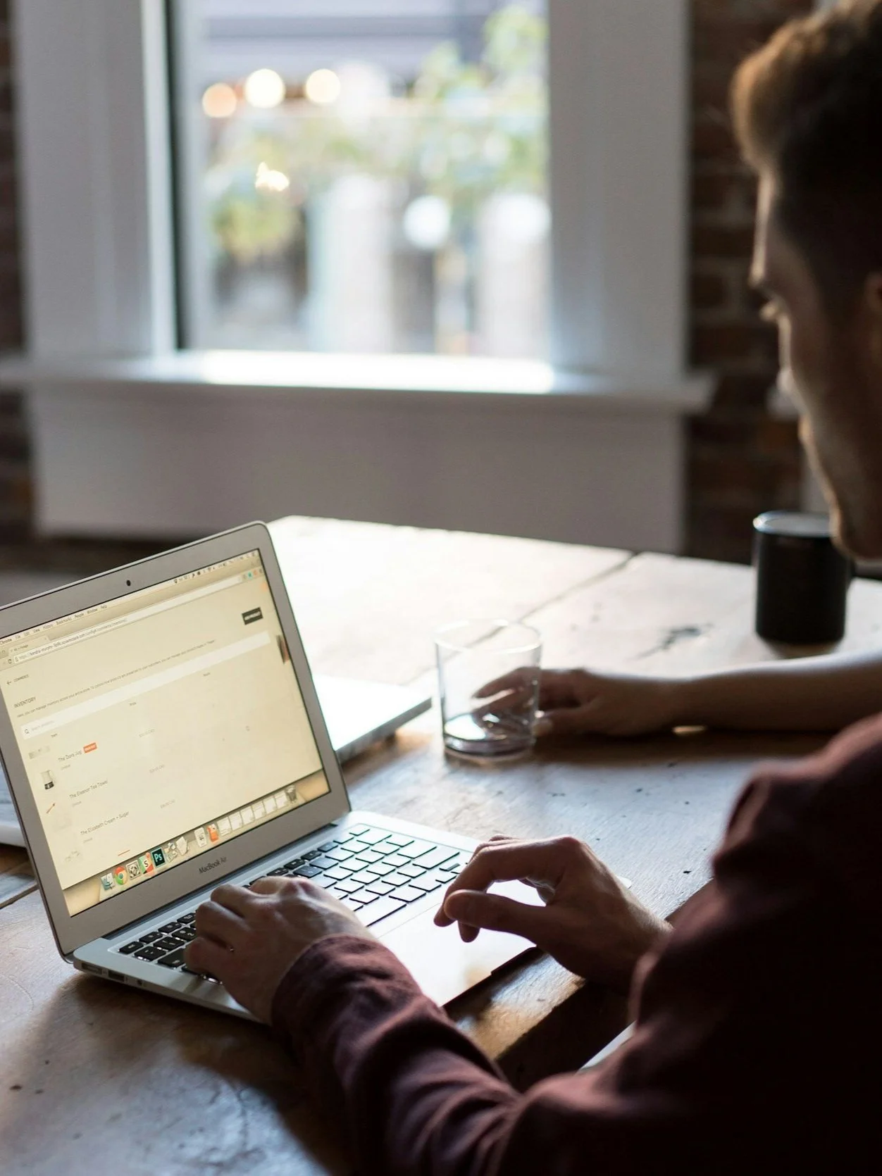 a photo of a man doing search on a laptop computer