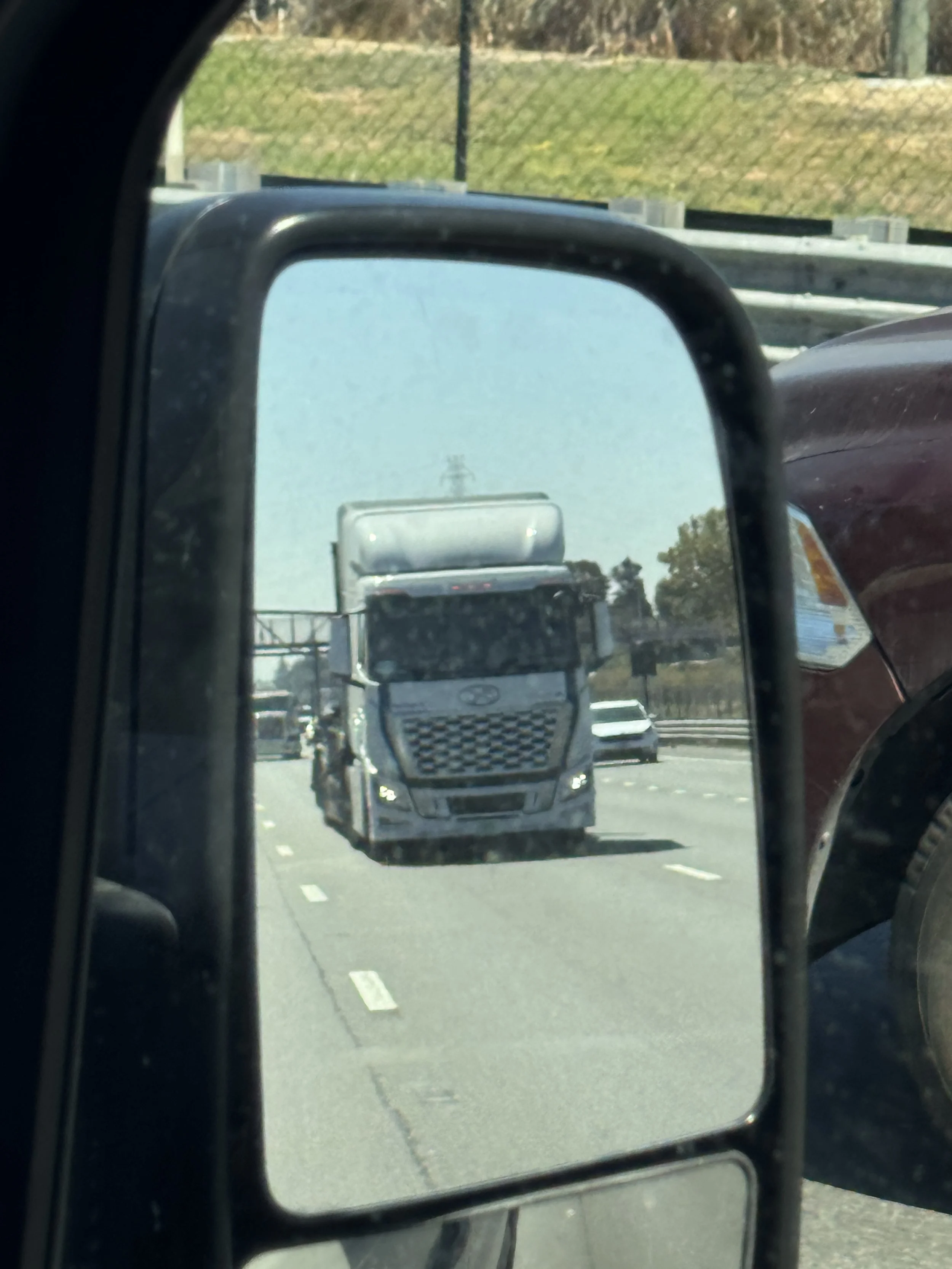 Hydrogen Meets Electric: Spotting a Hyundai XCIENT Fuel Cell Truck Hauling Rivian R1Ts on Highway 101