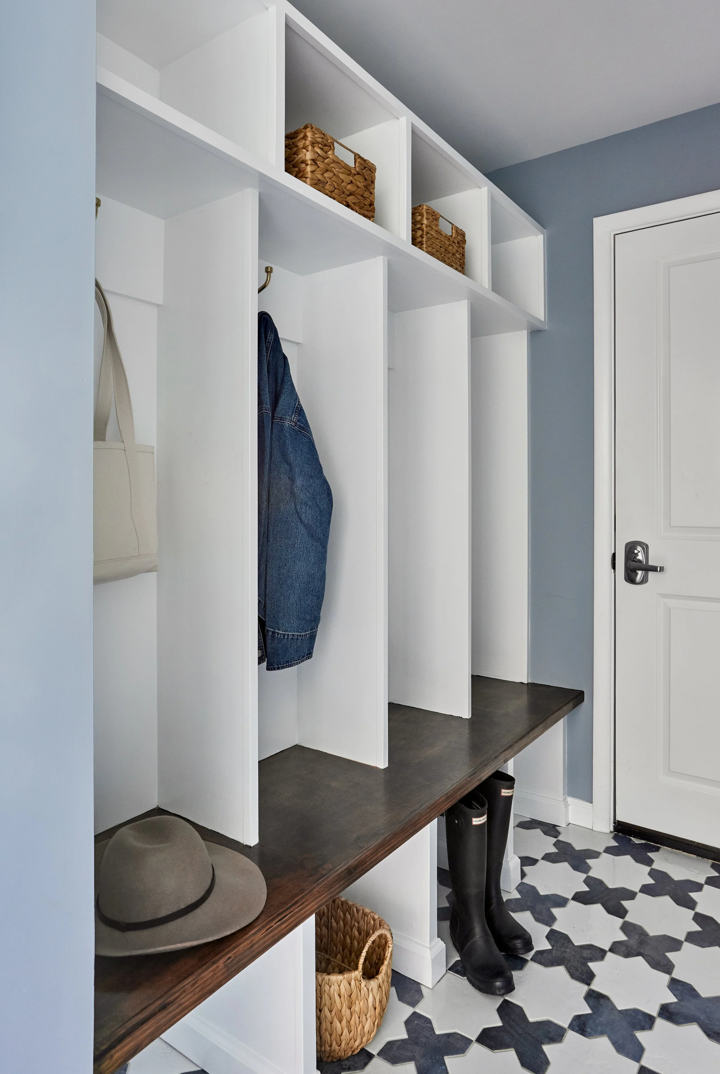 mudroom-white-built-in-cubbies-light-blue-walls.jpg