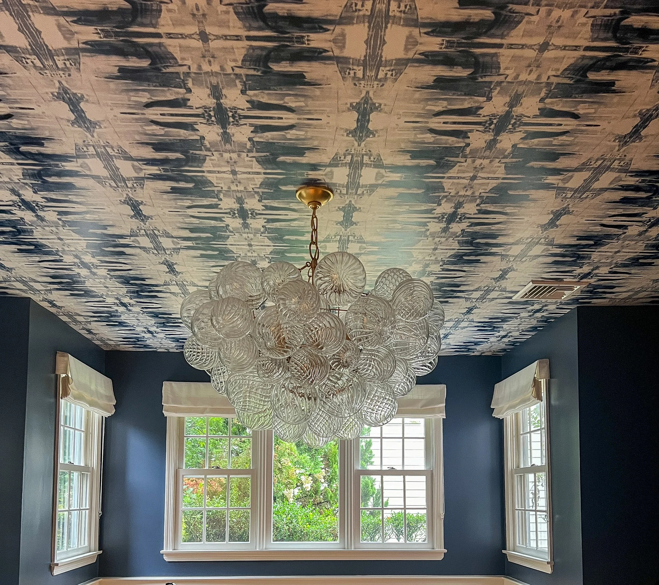 navy-dining-room-globe-crystal-chandelier-ikat-ceiling.JPG