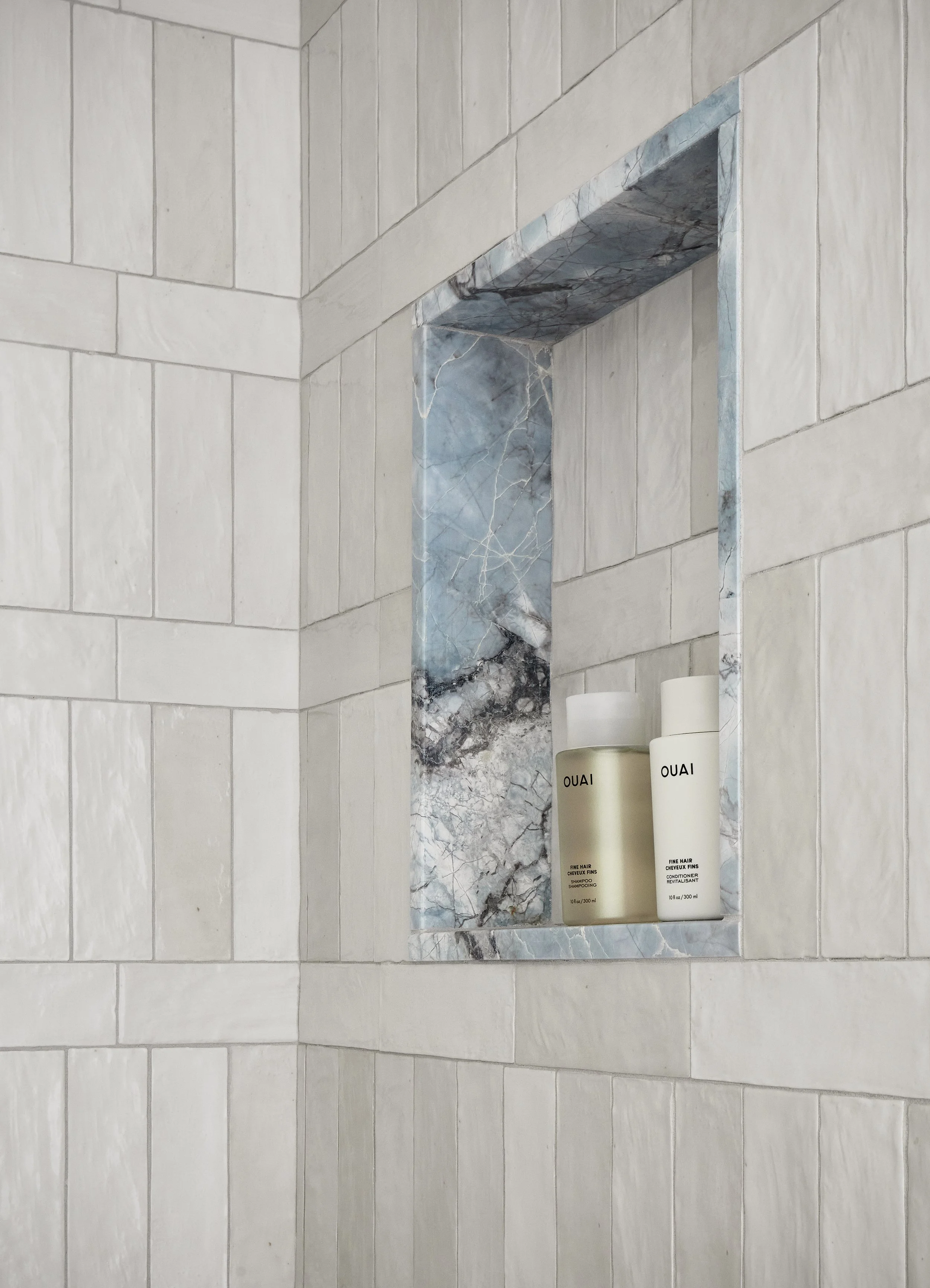 shower-niche-marble-shelf-white-tile-bathroom-detail.jpg
