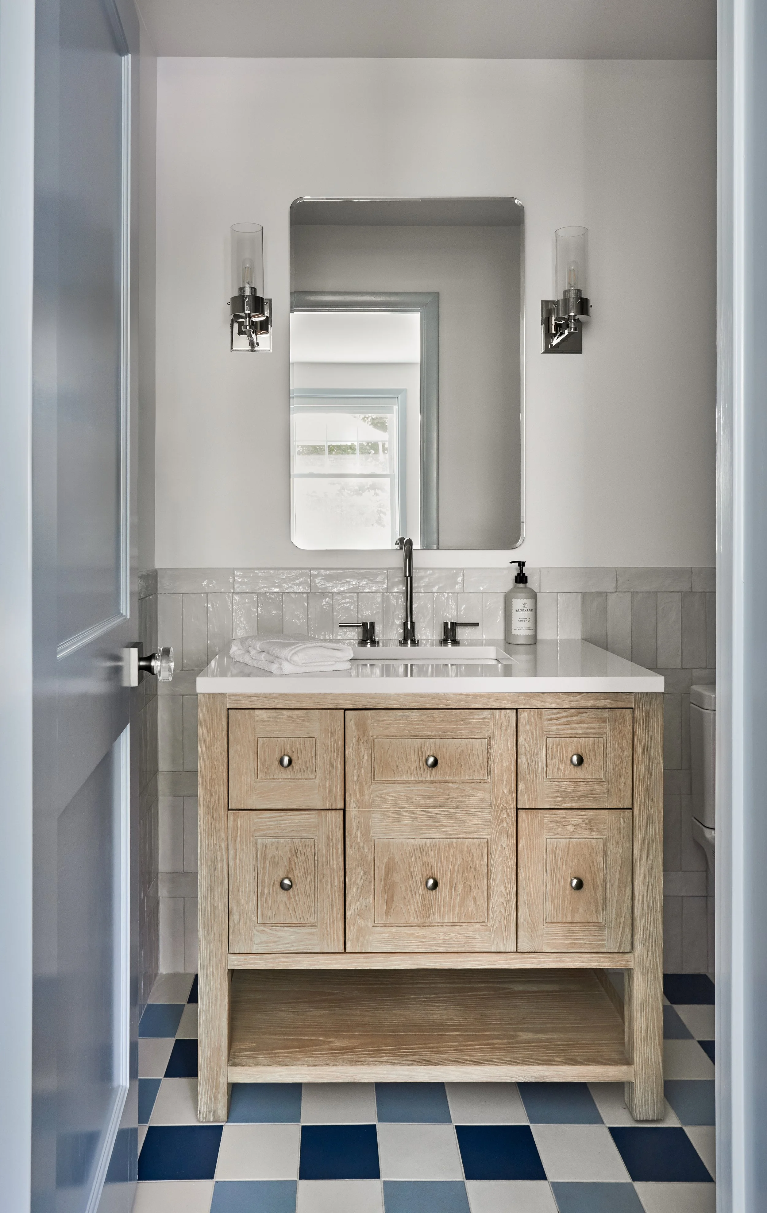 powder-room-oak-vanity-navy-white-checkered-tile.jpg