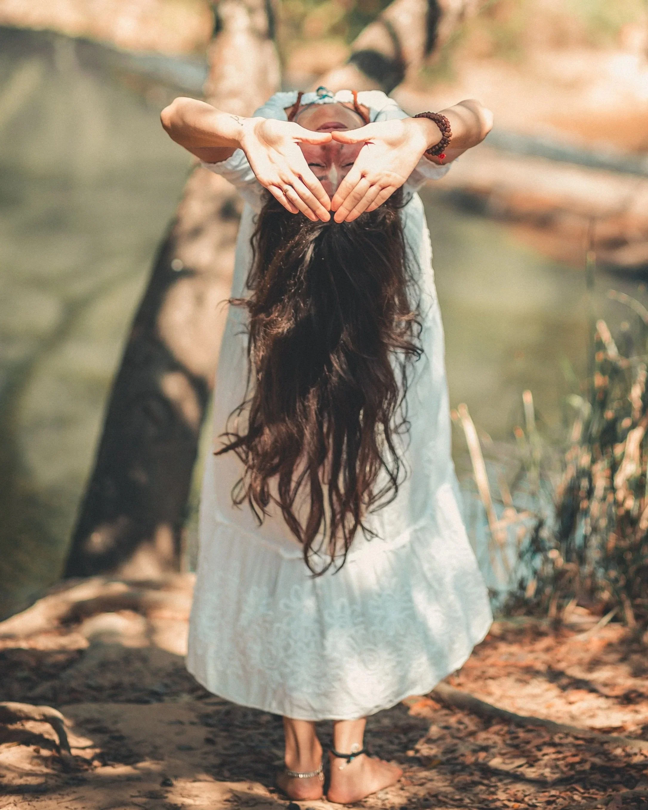 Woman embracing a calm moment, symbolizing personal alignment, intentional living, and self-acceptance.