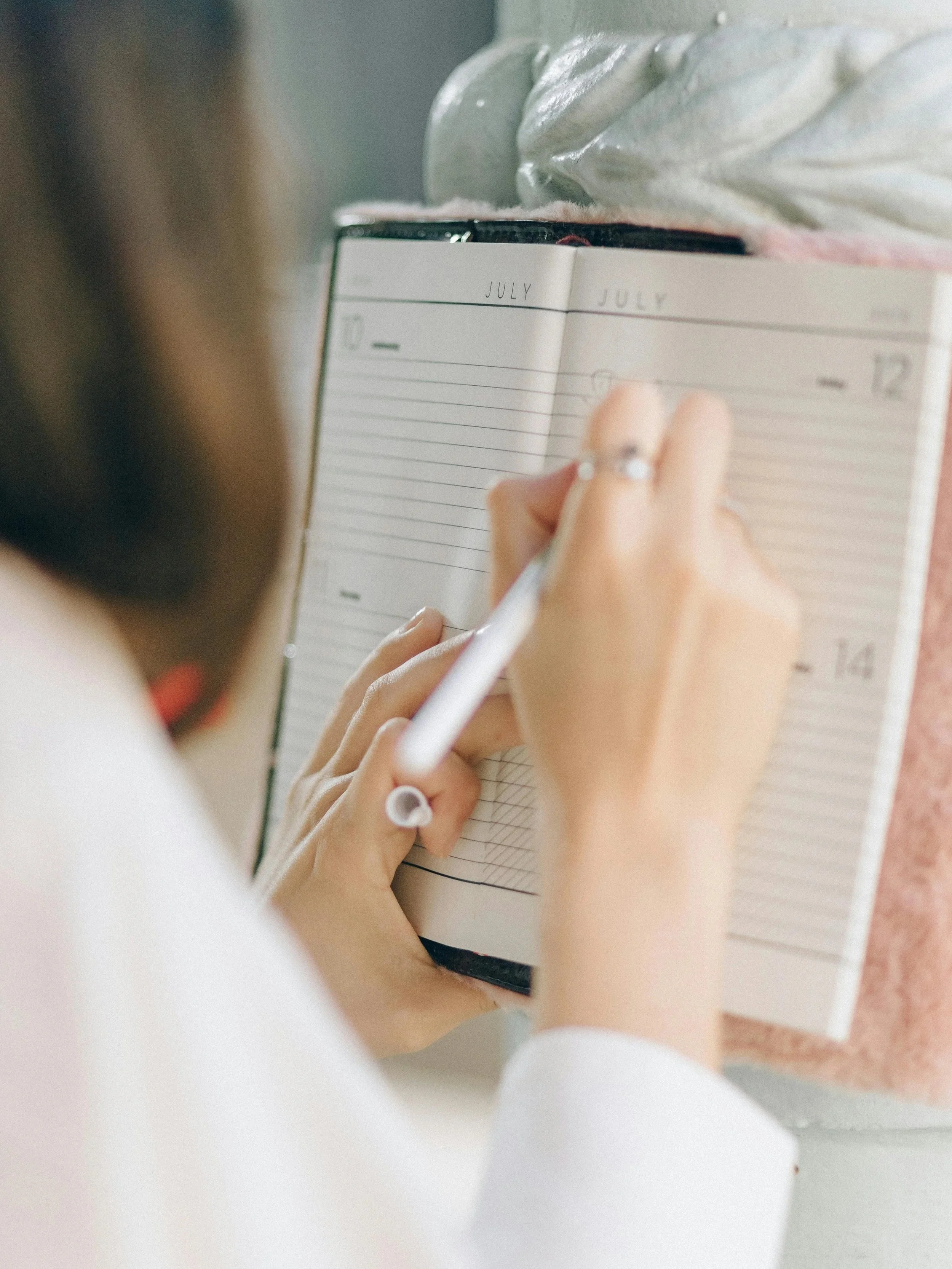 woman journaling and planning long term goals with intention