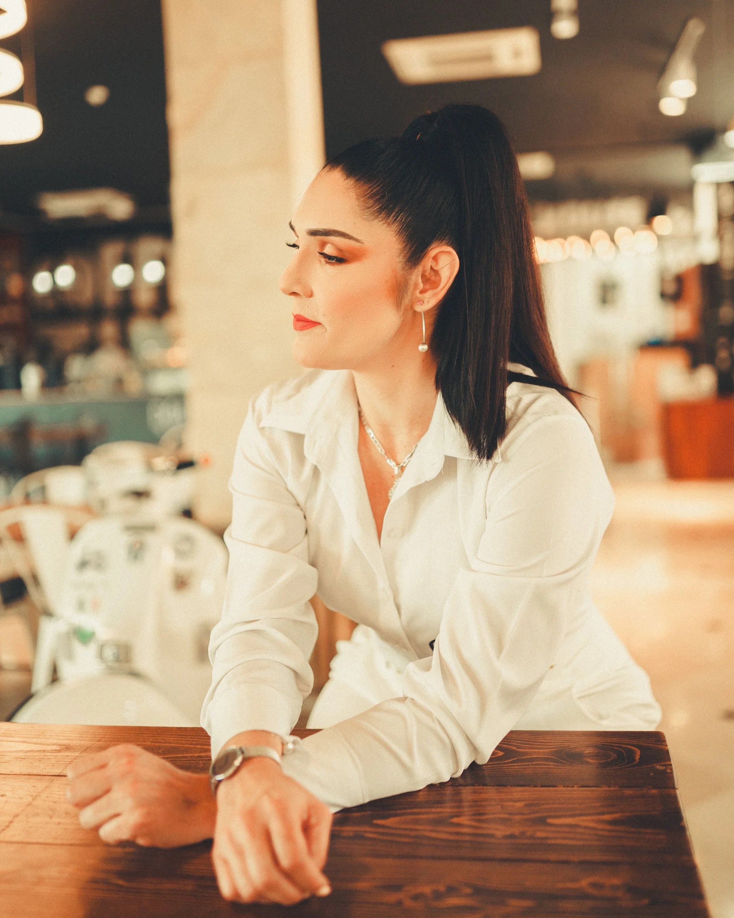 Woman looking thoughtfully into the distance, representing self-reflection, comparison, and living an authentic life.