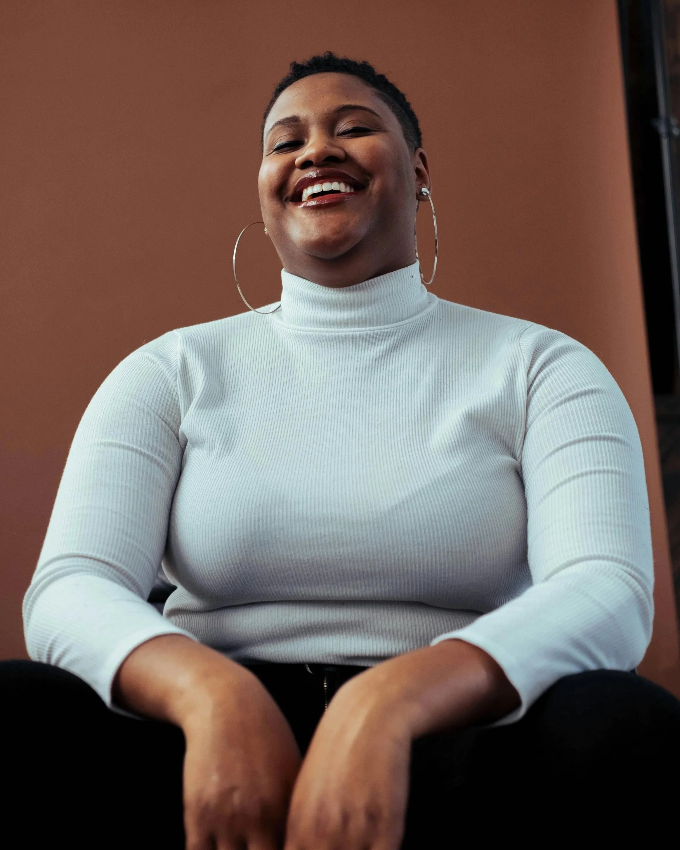 woman feeling confident smiling and content