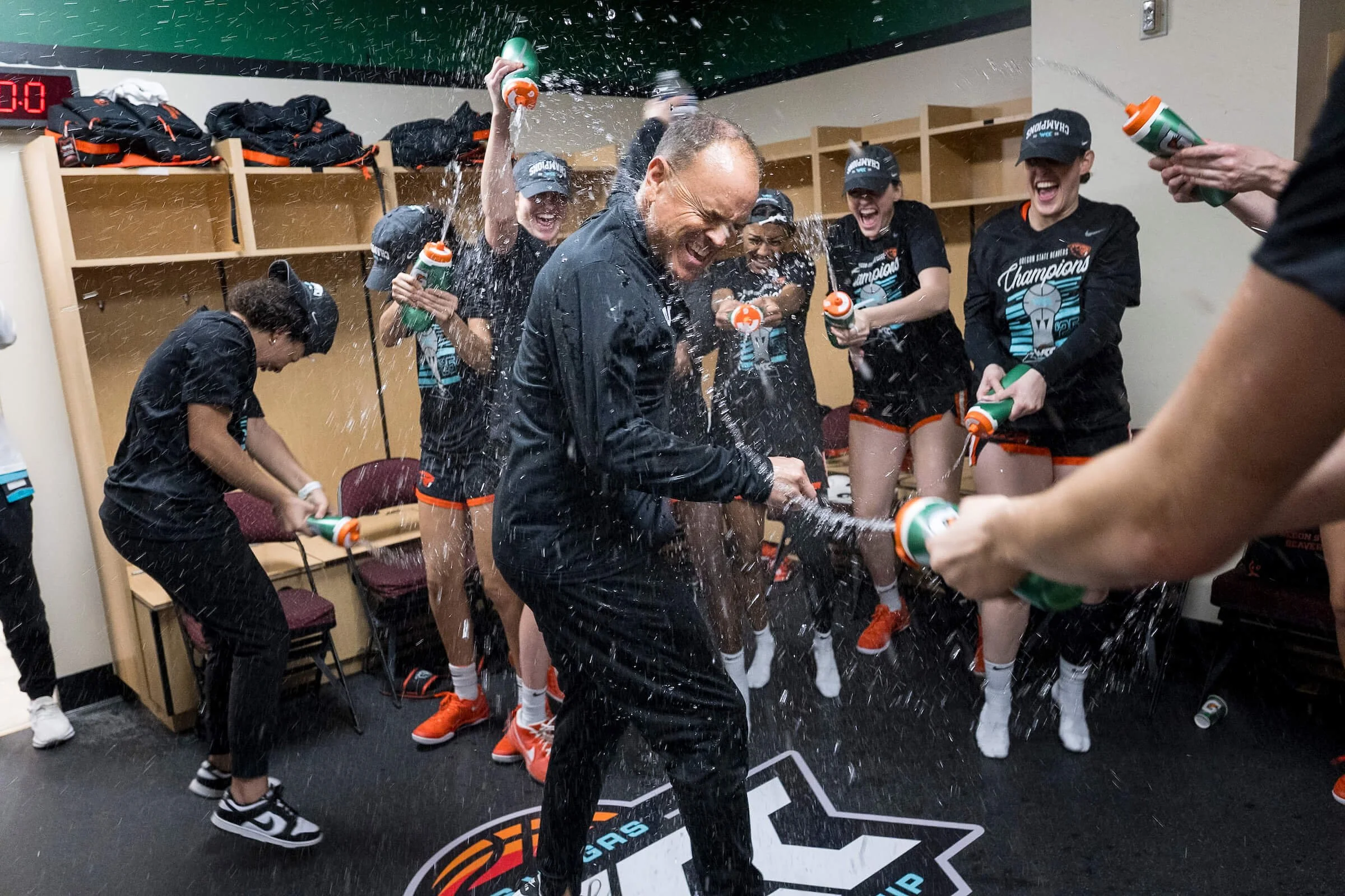 Coach Scott Rueck, here celebrating a WCC Tournament championship in 2025, is entering his 17th season at the Beaver helm (courtesy OSU sports communications)
