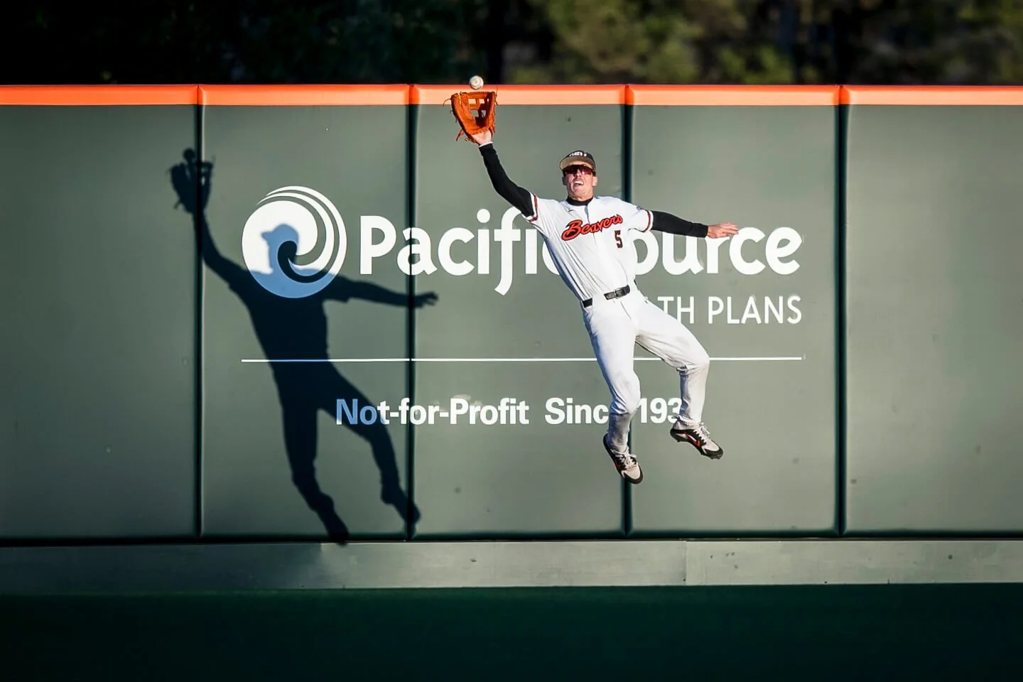 Joe Casey — yes, the coach’s son — makes a leaping catch at the fence in 2021 (courtesy Karl Maasdam)