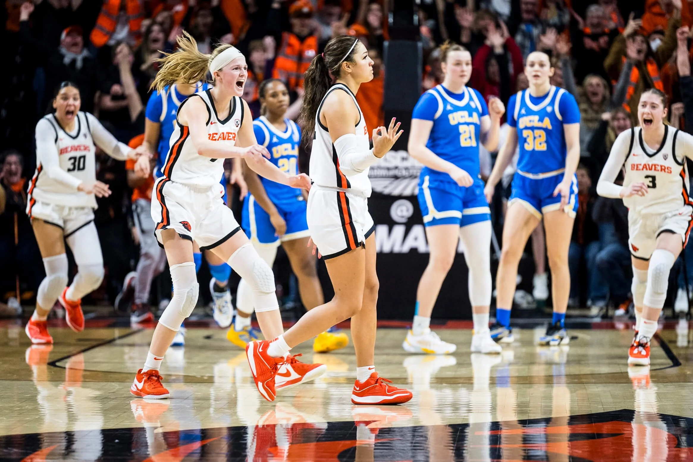 OSU’s Talia von Oelhoffen gets some love from teammates after burying a critical 3-pointer against UCLA in 2024 (courtesy Karl Maasdam)