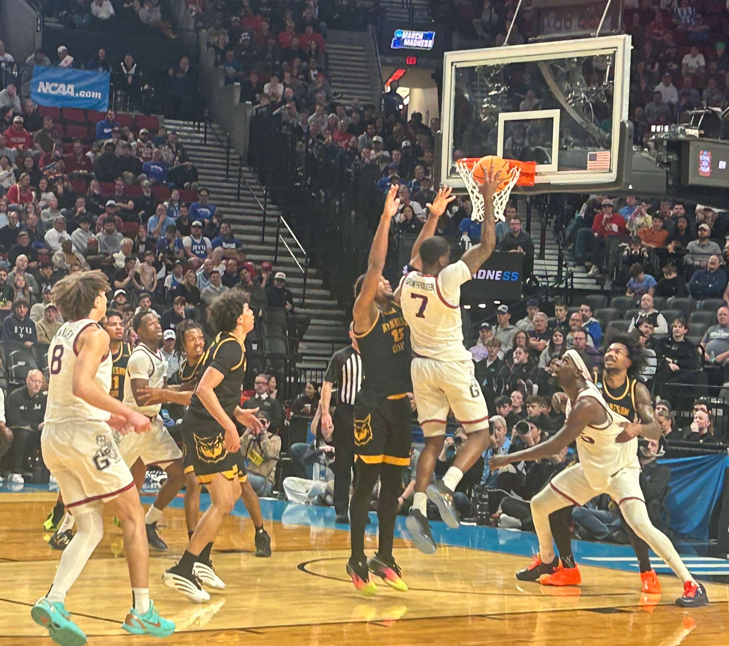 Tyon Grant-Foster (7) drives as teammate Graham Dike (15) positions underneath in Gonzaga’s 73-64 win over Kennesaw State