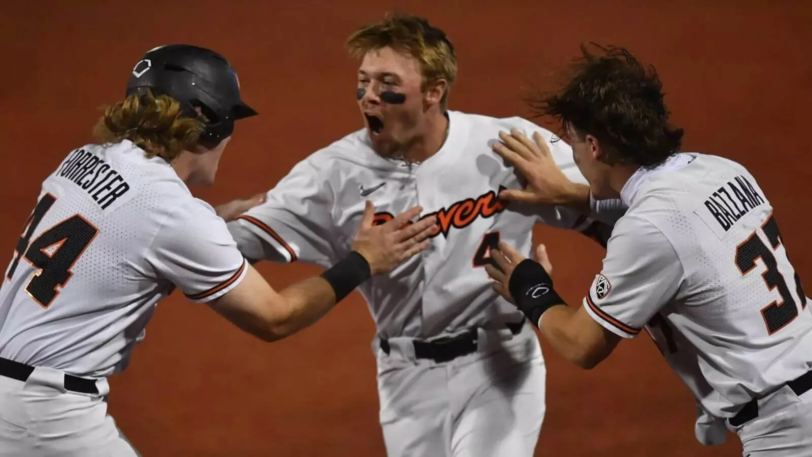 Boyd, here celebrating with teammates Garret Forrester (left) and Travis Bazzana, had a sensational final season at OSU in 2022 (courtesy OSU sports communications)