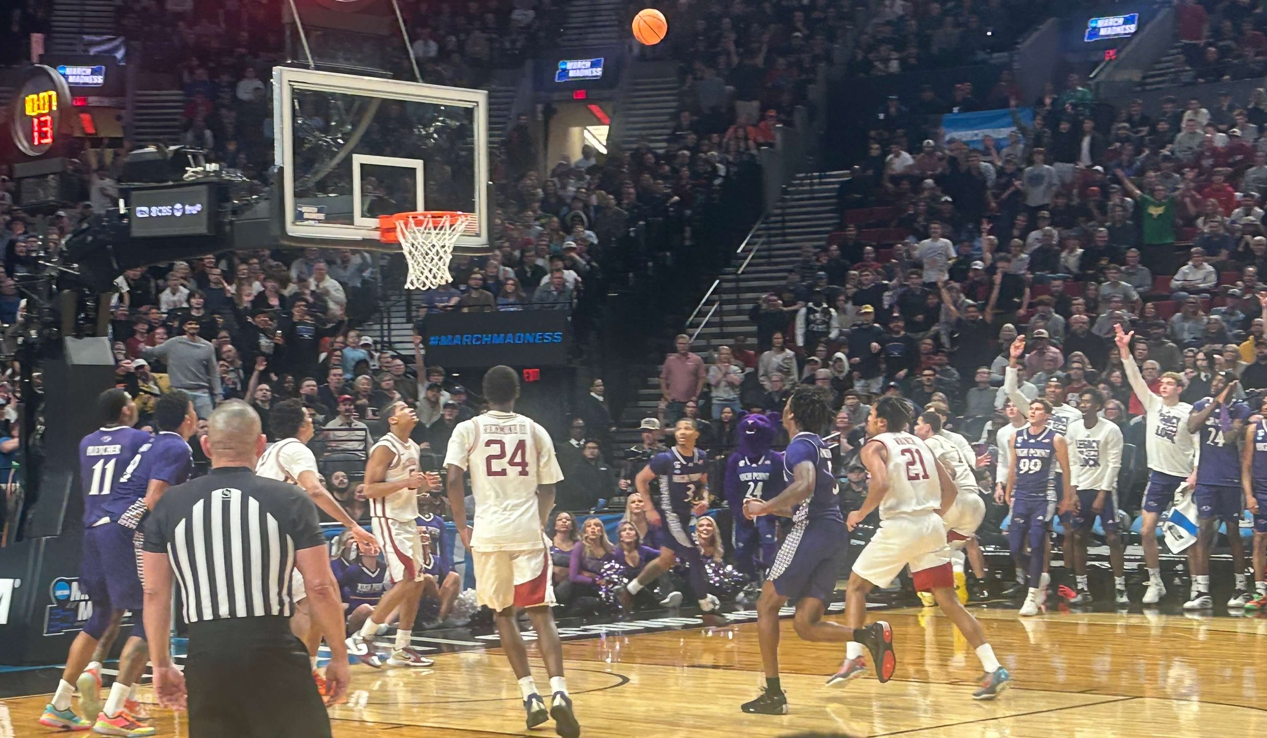 High Point’s Chase Johnston (99 in purple) watches as his corner 3 heads to the basket late in the game