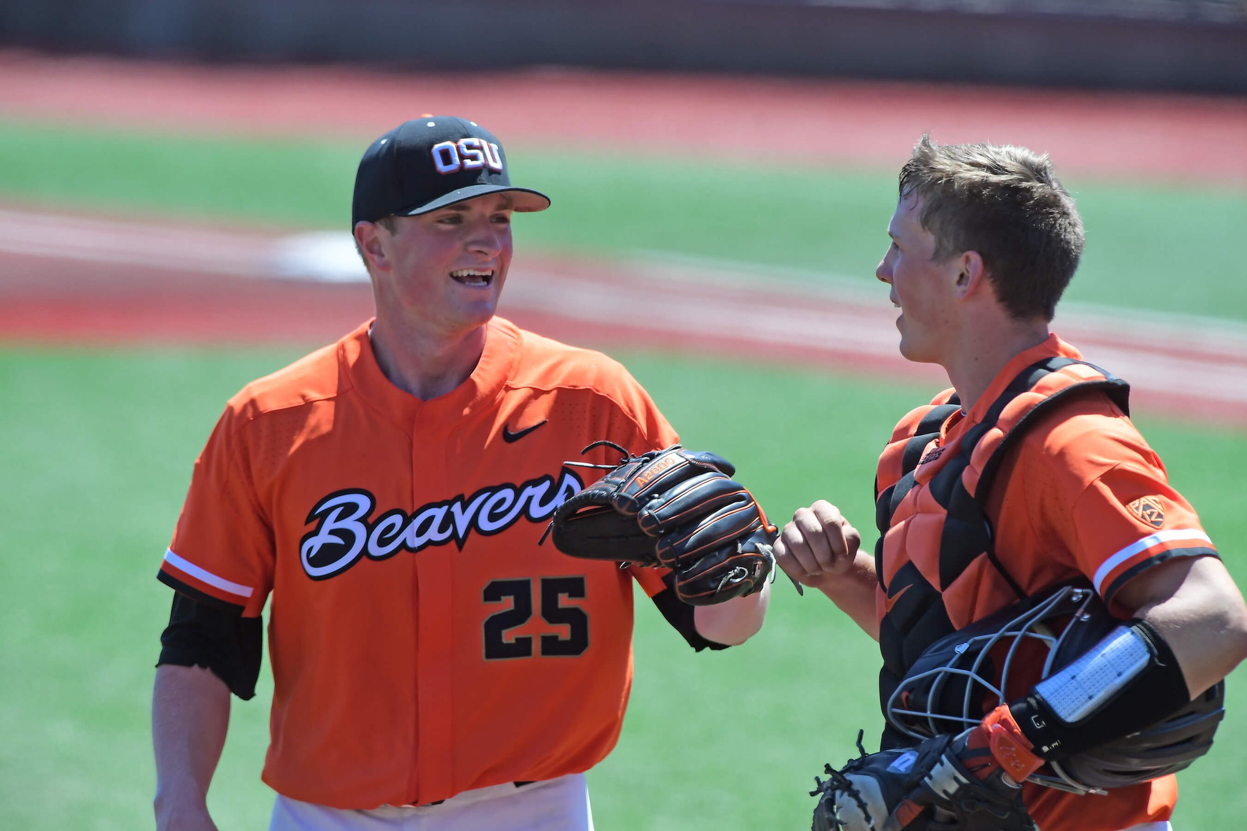 During a year of inaction in 2018, Rasmussen was still a positive influence on such teammates as Adley Rutschman, right (courtesy Dave Nishitani)