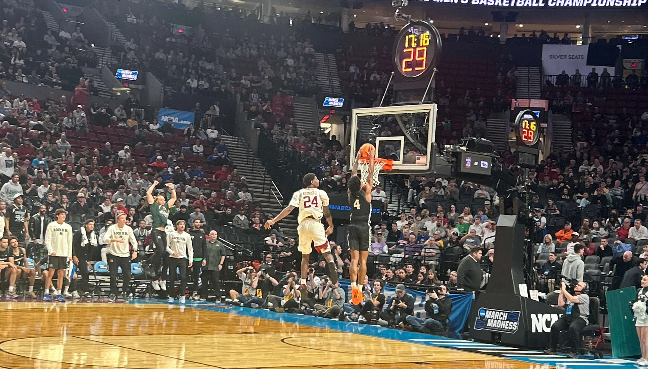 Hawaii’s Dre Bullock (4) dunks for two of his team-high 21 points, but the Rainbow Warriors fell 97-78 to Arkansas