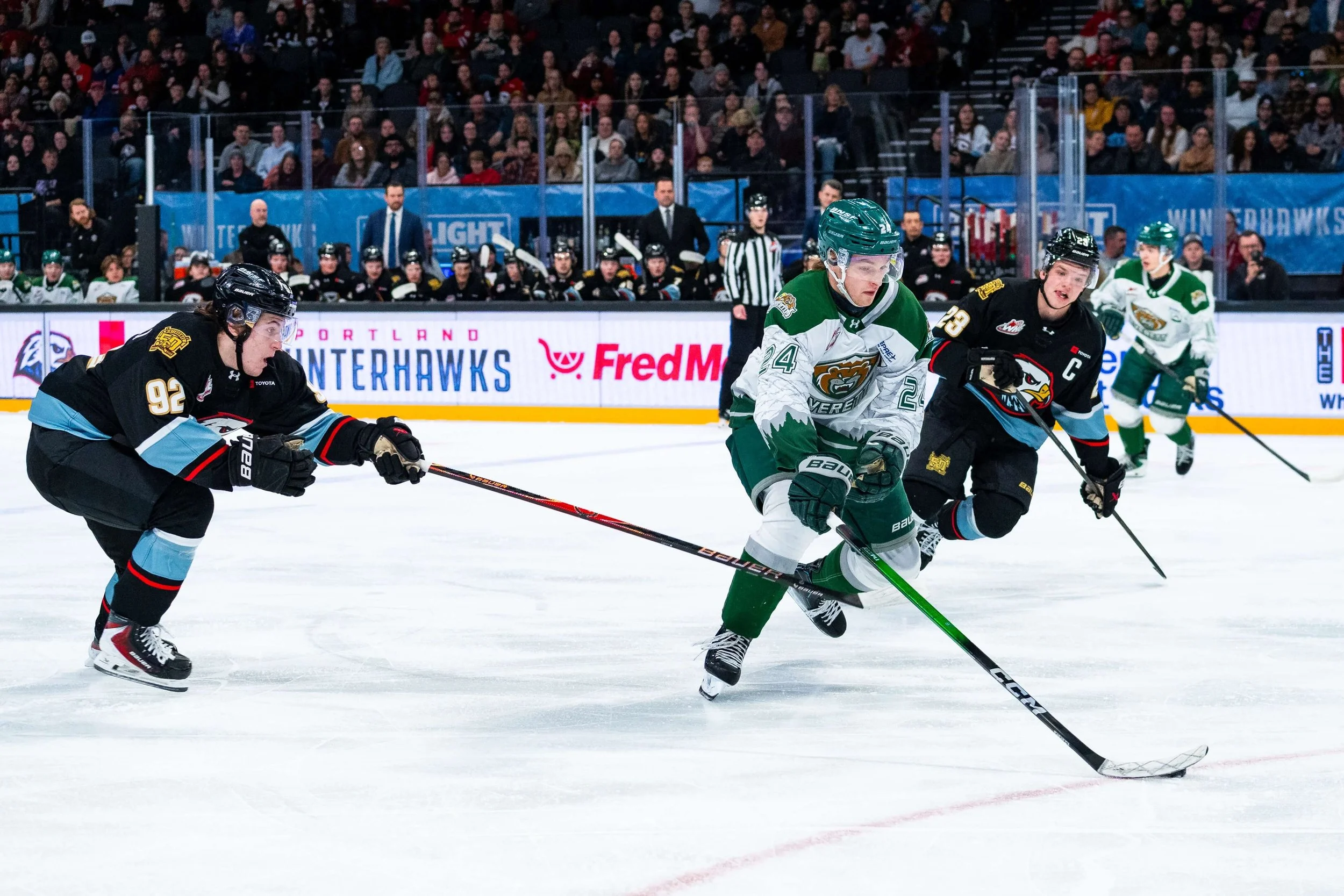 Allessandro Domenichelli (92) got away with this apparent trip of the Silvertips’ Tarin Smith, but the 16-year-old rookie scored his second goal of the season (courtesy Winterhawks/Kai Brown)