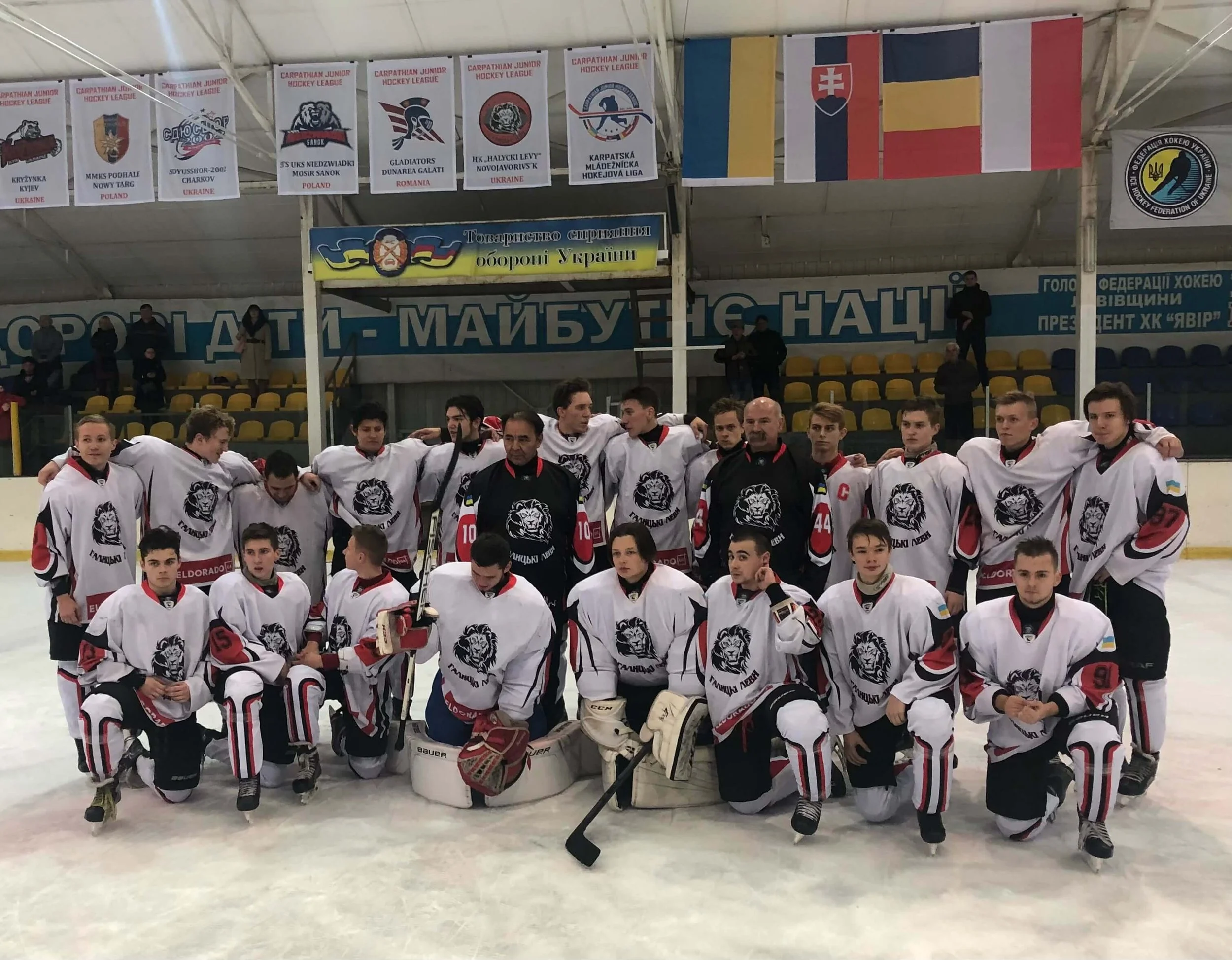 Wayne Babych (in black, left) and Dave Babych (in black, right) with a Ukraine junior hockey club they conducted a clinic for on a visit to the country in 2019 (courtesy Wayne Babych)