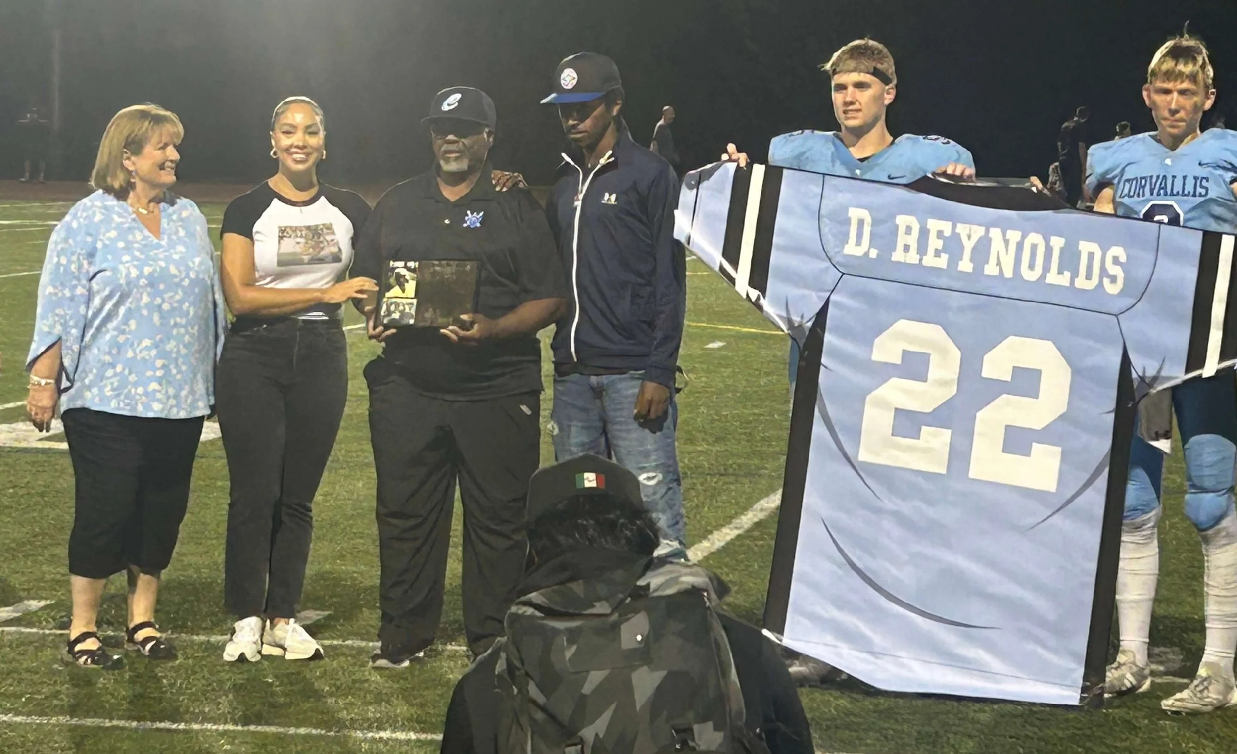 From left, Jan, Simone, Donny and Isaac Reynolds during the halftime ceremony