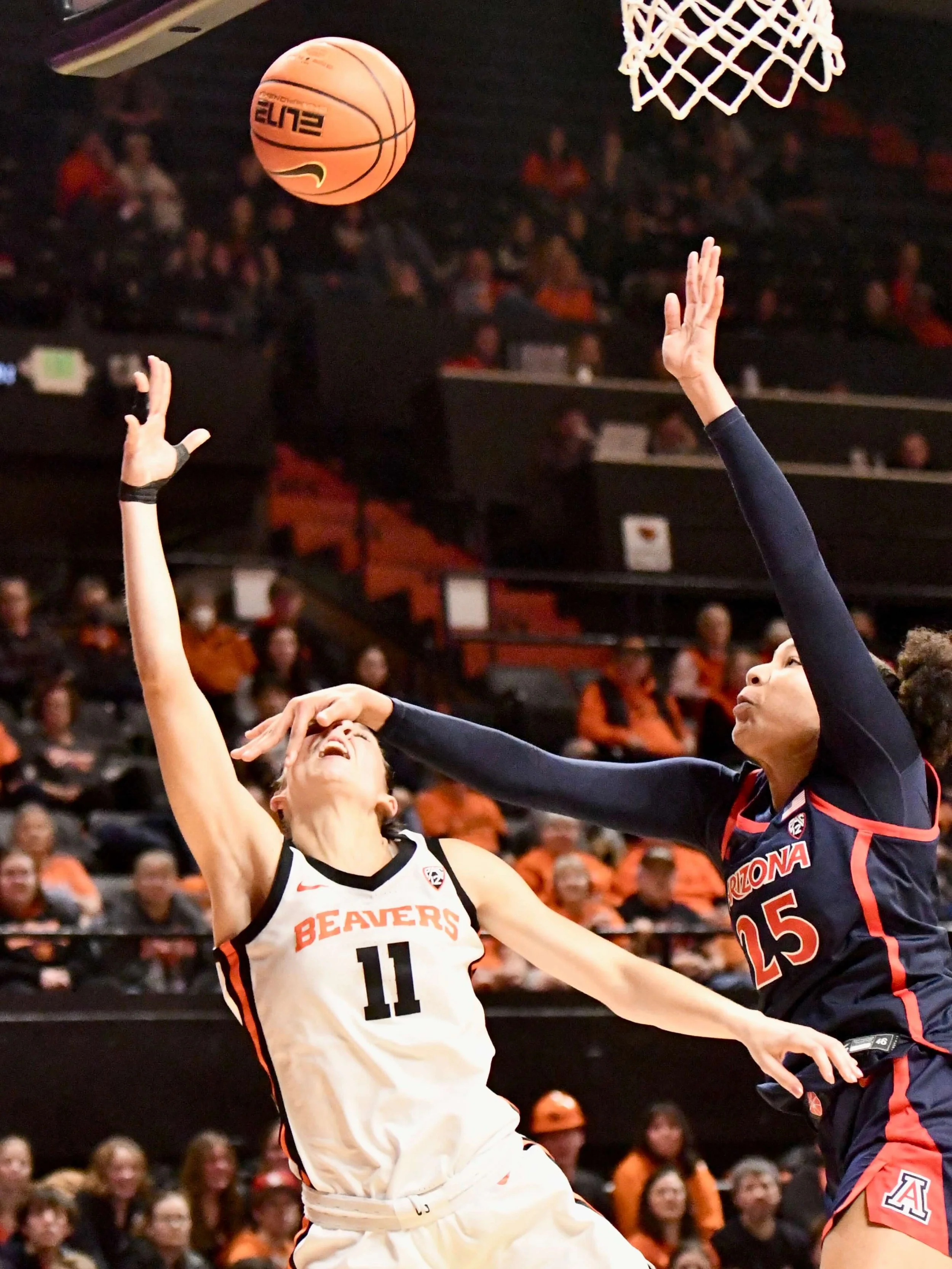 Arizona’s Breya Cunningham (25) turns out the lights on OSU’s AJ Marotte, who converts a basket and a three-point play in 2025 (courtesy Dominic Cusimano)