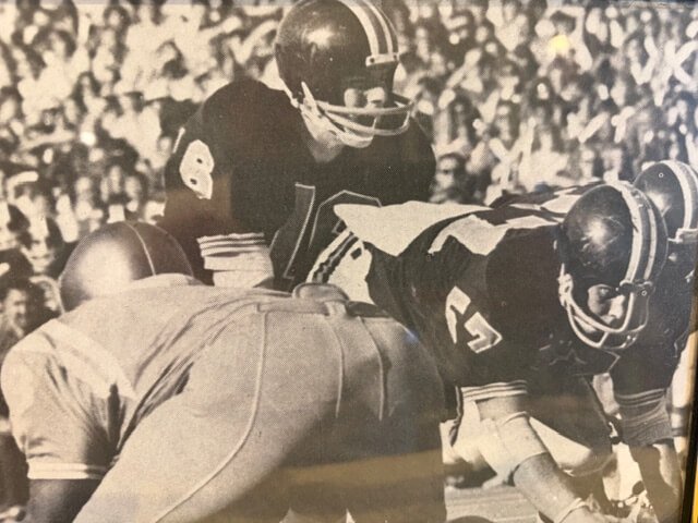 Greg Krpalek (57) prepares to snap the ball to quarterback Scott Spiegelberg for Oregon State in a game against UCLA in 1972 (courtesy John Eggers)