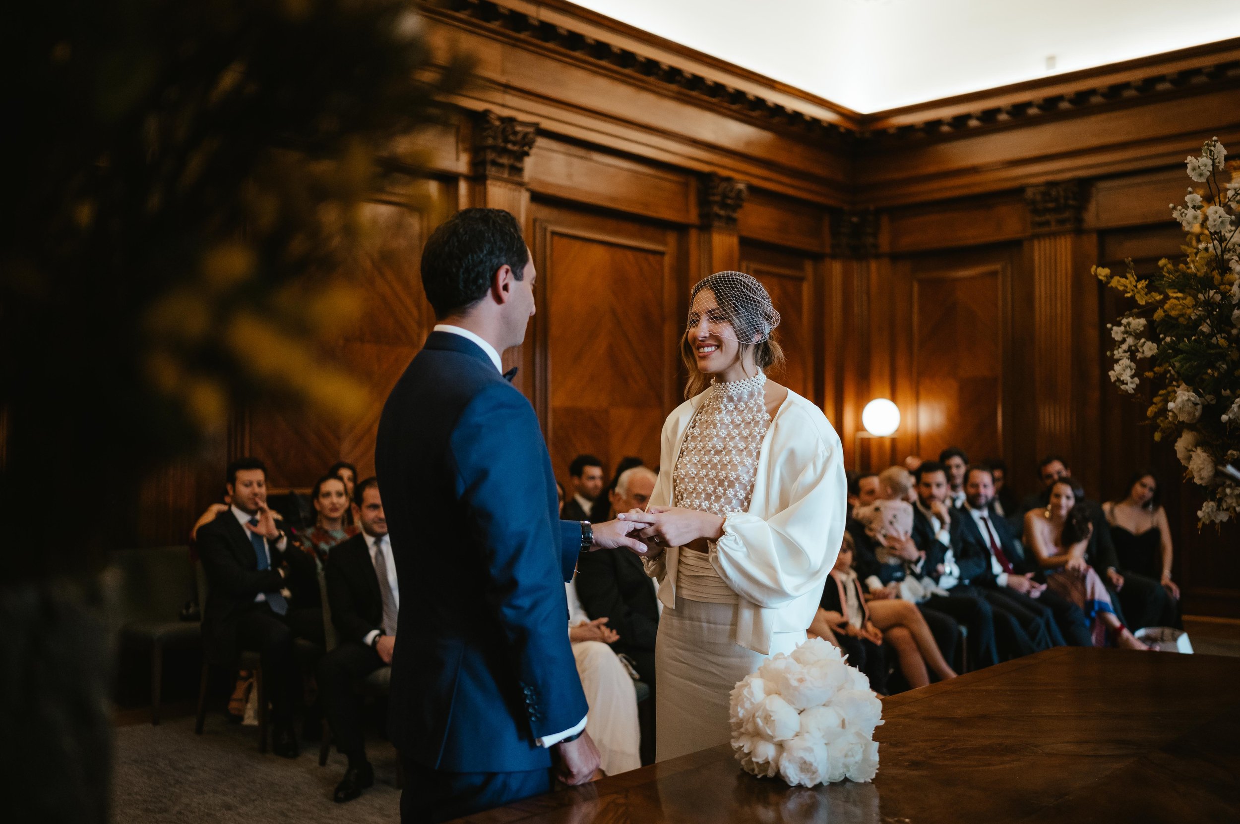 couple exchange rings at small london wedding